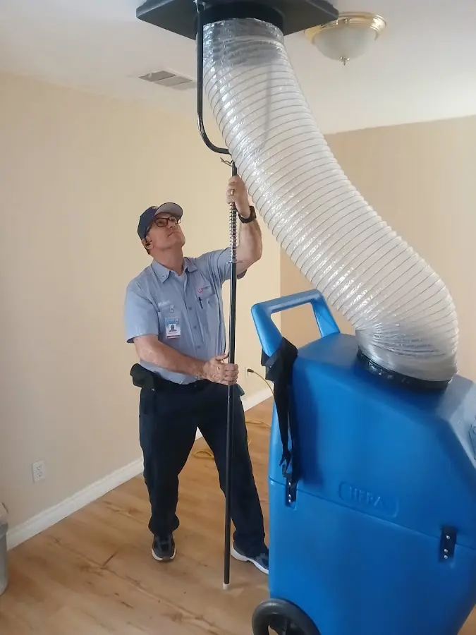 Furnace Tune-Up technician using HEPA equipment in Skippack
